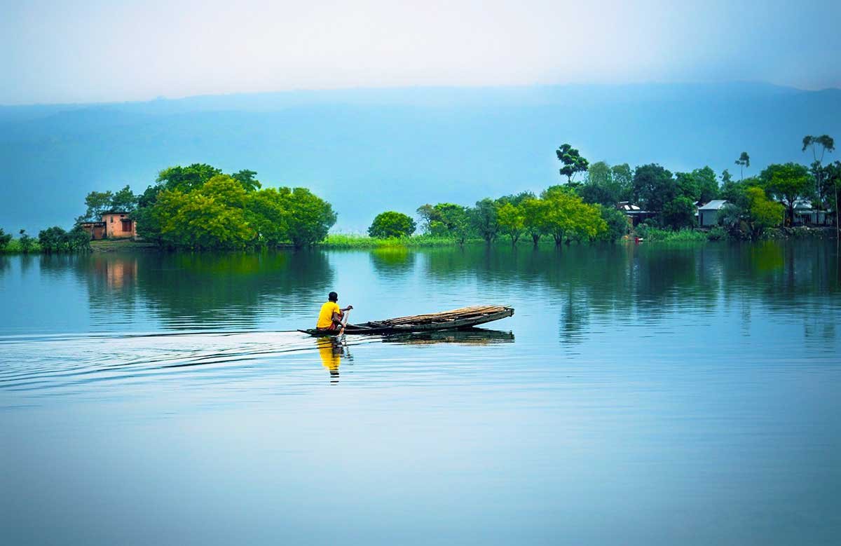 A peaceful waterside landscape in Bangladesh